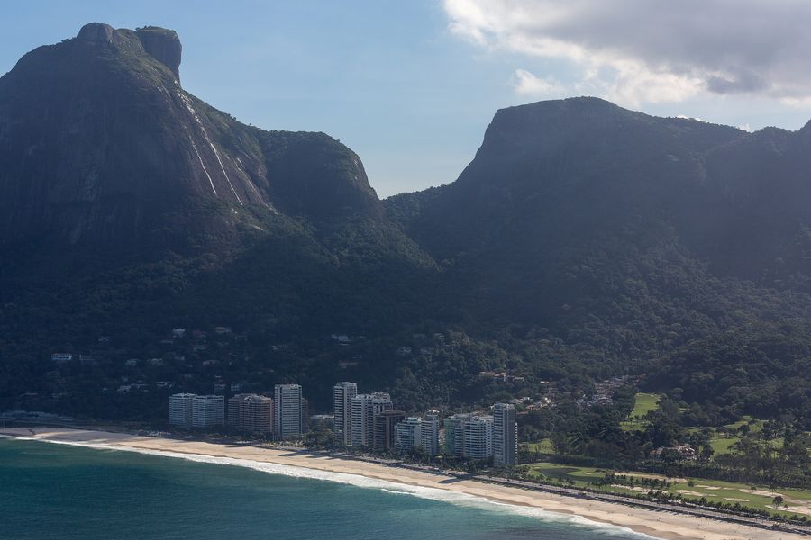 Aerial view of São Conrado Beach and its seafront towers, with Pedra da Gávea and Pedra Bonita rising behind